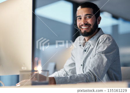 Call center, happy man and portrait at computer for customer service, telemarketing sales and CRM consulting at night. Male agent, desktop pc and smile for communication, advice and technical support 135161229