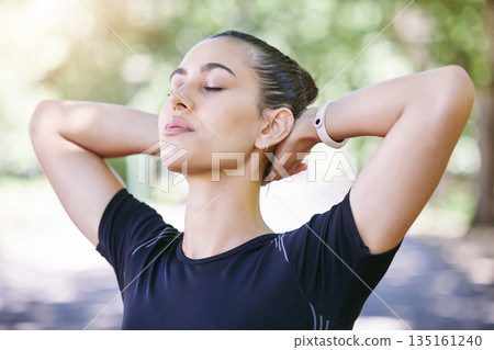 Fitness, runner or woman stretching her neck for workout or body movement while relaxing on break. Wellness, athlete or healthy girl in exercise training warm up for flexibility or mobility in park 135161240