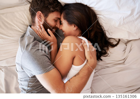 Smile, bedroom hug and happy couple laughing at funny joke, relationship humour or home comedy in Spain. Marriage happiness, love bond and top view of relax man, woman or morning people laugh in bed 135161306