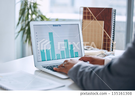 Hands typing, laptop and chart in office for finance, economy or stock market analysis with software. Man, computer and graph for big data analytics, accounting and cloud computing with dashboard ux Hands typing, laptop and chart in office for finance, economy or stock market analysis with software. Man, computer and graph for big data analytics, accounting and cloud computing with dashboard ux 135161308
