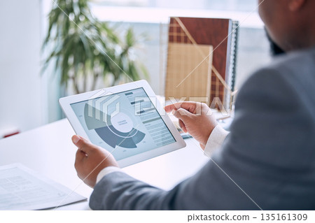 Hands typing, tablet and charts in office for customer expansion, sales analysis and statistics. Man, touchscreen and graph for big data analytics, client base or cloud computing with dashboard ux 135161309