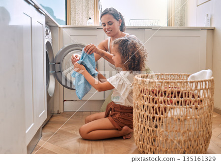 Happy, laundry and washing machine with mother and daughter for helping, learning and cleaner. Housekeeping, teamwork and basket with woman and young girl in family home for teaching and cleaning Happy, laundry and washing machine with mother and daughter for helping, learning and cleaner. Housekeeping, teamwork and basket with woman and young girl in family home for teaching and cleaning 135161329