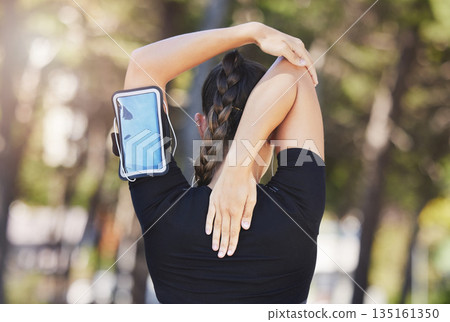 Fitness, runner or woman stretching arms ready for workout, exercise or workout or body movement. Phone, back view of athlete or healthy girl in running warm up for flexibility or mobility in park Fitness, runner or woman stretching arms ready for workout, exercise or workout or body movement. Phone, back view of athlete or healthy girl in running warm up for flexibility or mobility in park 135161350