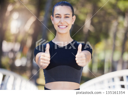 Runner, portrait or happy girl with thumbs up in park for fitness training with positive mindset or smile. Motivation, workout or woman smiling with like sign, hand gesture or thumb up in nature Runner, portrait or happy girl with thumbs up in park for fitness training with positive mindset or smile. Motivation, workout or woman smiling with like sign, hand gesture or thumb up in nature 135161354