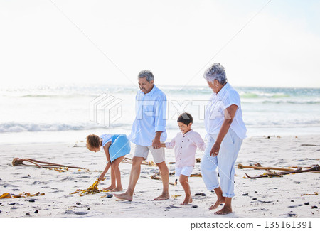 Beach, grandparents or happy children holding hands, walking or smiling as a family in nature. Grandmother, senior grandfather or young kids siblings bonding or taking walk together at sea Beach, grandparents or happy children holding hands, walking or smiling as a family in nature. Grandmother, senior grandfather or young kids siblings bonding or taking walk together at sea 135161391