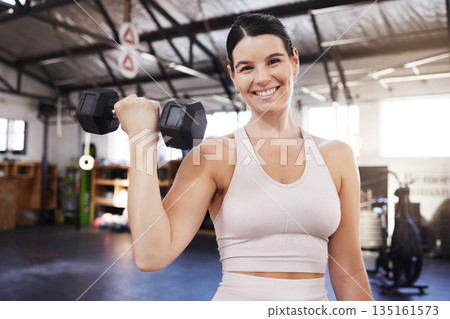 Dumbbells, happy and exercise with a woman at gym for fitness, training workout and strong muscle. Portrait of athlete person with iron weights for power, motivation and performance at wellness club Dumbbells, happy and exercise with a woman at gym for fitness, training workout and strong muscle. Portrait of athlete person with iron weights for power, motivation and performance at wellness club 135161573
