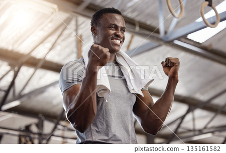 Goals, success and fitness with a man at gym for exercise, training workout and strong muscle. African athlete or bodybuilder person celebrating with fist for power challenge win or achievement Goals, success and fitness with a man at gym for exercise, training workout and strong muscle. African athlete or bodybuilder person celebrating with fist for power challenge win or achievement 135161582