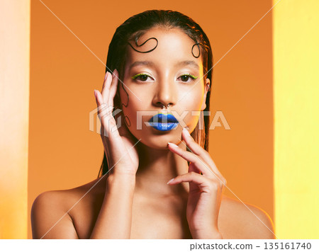 Makeup art, beauty and portrait of woman in studio for cosmetics, eye shadow and hairstyle. Creative design, cosmetology and face of female person with blue lipstick for glamour, fashion and style Makeup art, beauty and portrait of woman in studio for cosmetics, eye shadow and hairstyle. Creative design, cosmetology and face of female person with blue lipstick for glamour, fashion and style 135161740