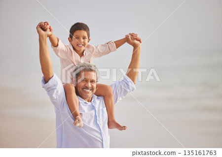 Piggyback, portrait or grandfather with child at sea as a happy family outdoors in nature together. Face, play or lovely grandparent with young boy or kid outside with freedom on fun summer holiday Piggyback, portrait or grandfather with child at sea as a happy family outdoors in nature together. Face, play or lovely grandparent with young boy or kid outside with freedom on fun summer holiday 135161763