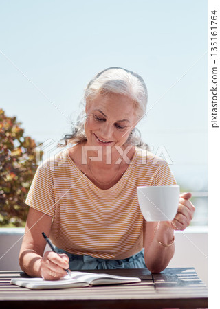 Writing, book and coffee with an old woman author sitting outdoor in summer for inspiration as a writer. Idea, planning and notebook with a senior pensioner using a pen to write in a journal or diary Writing, book and coffee with an old woman author sitting outdoor in summer for inspiration as a writer. Idea, planning and notebook with a senior pensioner using a pen to write in a journal or diary 135161764