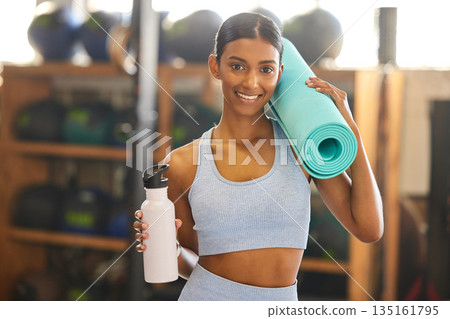 Mat, portrait or happy woman with water in gym ready for training, workout or exercise with smile. Fitness, athlete smiling or sports girl with bottle for healthy liquid hydration to start exercising Mat, portrait or happy woman with water in gym ready for training, workout or exercise with smile. Fitness, athlete smiling or sports girl with bottle for healthy liquid hydration to start exercising 135161795