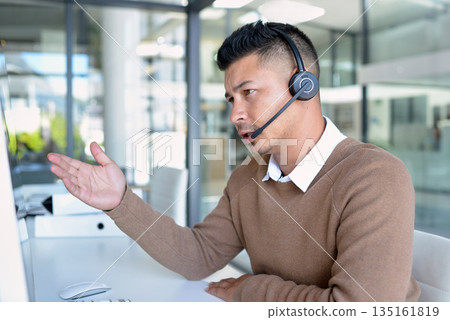 Man, callcenter with phone call and CRM, contact us and communication with headset in office. Male consultant in customer service, telemarketing or tech support with help desk job, advice and telecom 135161819