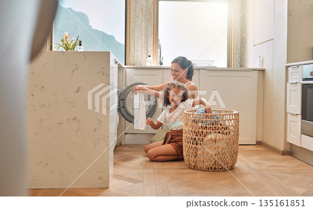 Cleaning, teamwork and washing machine with mother and daughter for helping, learning and cleaner. Housekeeping, laundry and basket with woman and young girl in family home for teaching and clothes 135161851