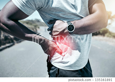 Exercise, back pain and injury with a sports man holding his sore body while outdoor for a workout. Fitness, anatomy and accident with a male athlete feeling tender while training for a cardio run 135161891