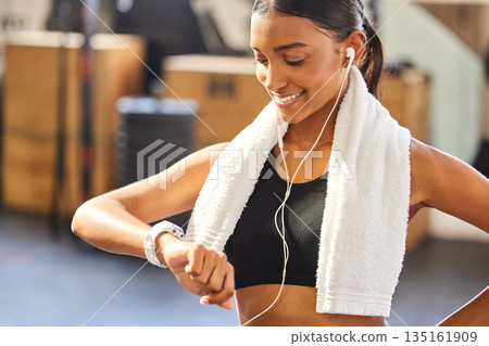 Fitness, timer or happy woman with smartwatch to monitor workout, exercise or training performance. Gym, smile or healthy sports athlete checking smart watch heart rate, pulse or progress results Fitness, timer or happy woman with smartwatch to monitor workout, exercise or training performance. Gym, smile or healthy sports athlete checking smart watch heart rate, pulse or progress results 135161909