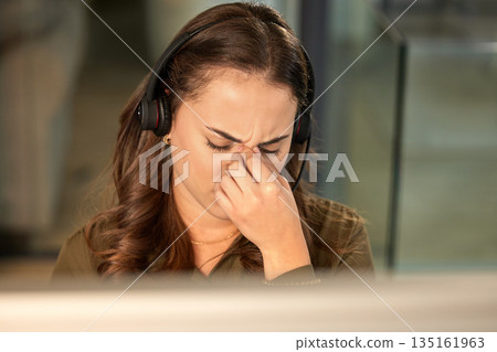 Stress, call center and woman with a headache, telemarketing and overworked with burnout. Female person, consultant and agent with a migraine, anxiety and customer service with crm and tech support 135161963