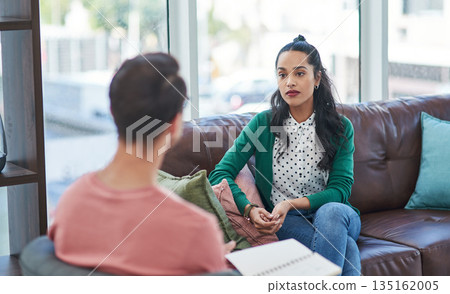 Mental health, therapy or counseling with a man psychologist and female patient talking in his office. Psychology, wellness and trust with a male doctor or therapist consulting a woman for healing Mental health, therapy or counseling with a man psychologist and female patient talking in his office. Psychology, wellness and trust with a male doctor or therapist consulting a woman for healing 135162005