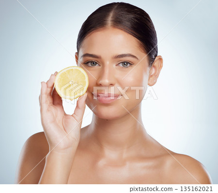Face, skincare and woman with lemon in studio isolated on a white background. Portrait, natural or female model with fruit for vitamin c, vegan nutrition or healthy diet, wellness or beauty cosmetics Face, skincare and woman with lemon in studio isolated on a white background. Portrait, natural or female model with fruit for vitamin c, vegan nutrition or healthy diet, wellness or beauty cosmetics 135162021