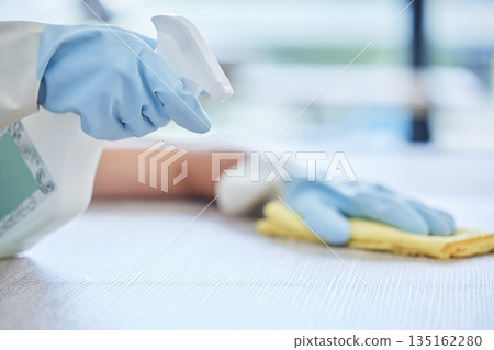 Hands, housekeeper and detergent for cleaning table, hygiene or bacteria and germ removal at home. Hand of person, cleaner or maid spraying and wiping furniture or surface for dust, dirt or stain Hands, housekeeper and detergent for cleaning table, hygiene or bacteria and germ removal at home. Hand of person, cleaner or maid spraying and wiping furniture or surface for dust, dirt or stain 135162280