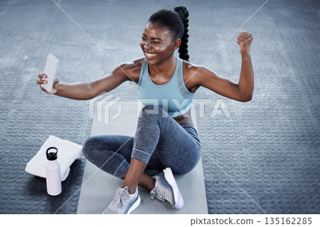 Gym, fitness or happy black woman taking selfie on workout, exercise or training break on social media. Wellness, smile or healthy African girl flexing, relaxing or taking pictures for online content 135162285