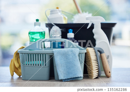 Basket, table and product for cleaning home with brush, cloth and chemical for hygiene by blurred background. Empty house, desk and plastic container for services, stop bacteria and dust in interior 135162286