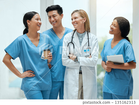 Diversity, teamwork or doctors talking on a break or laughing in a funny conversation in hospital. Happy people, joke or group of nurses medical employees on coffee breaks on lunch together in clinic Diversity, teamwork or doctors talking on a break or laughing in a funny conversation in hospital. Happy people, joke or group of nurses medical employees on coffee breaks on lunch together in clinic 135162313