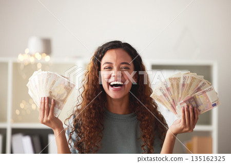 Happy woman with money in hands, savings and finance with success and celebrate financial goals. Budget, winning and wealth with cash fan, investment and female person winner with salary bonus Happy woman with money in hands, savings and finance with success and celebrate financial goals. Budget, winning and wealth with cash fan, investment and female person winner with salary bonus 135162325