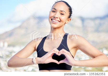 Happy woman, portrait and fitness with heart hands in nature for workout, exercise or cardio training outdoors. Fit, active or sport female person, athlete or runner with loving emoji or sign outside 135162351
