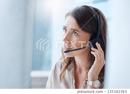Worry, call center and woman with telemarketing, customer service and stressed in a workplace. Female person, employee or agent with headphones, tech support and help desk with advice or mistake 135162363