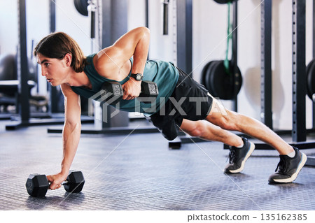 Fitness, dumbbell and push up with a man at gym for a workout, biceps exercise or training. Male athlete person with iron weights for strong muscle, focus and agile performance at wellness club Fitness, dumbbell and push up with a man at gym for a workout, biceps exercise or training. Male athlete person with iron weights for strong muscle, focus and agile performance at wellness club 135162385