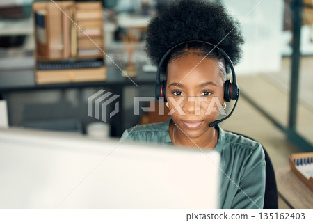 Call center, black woman and computer for telemarketing, business or customer service in office. Contact us, crm and serious African female sales agent, support consultant or professional person. 135162403