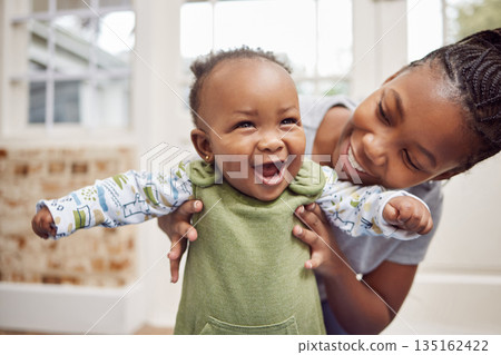 Love, woman with baby and in living room smile at their home. Happy family or care, happiness or comic and black female person with newborn laughing or smiling at their house indoors for support 135162422
