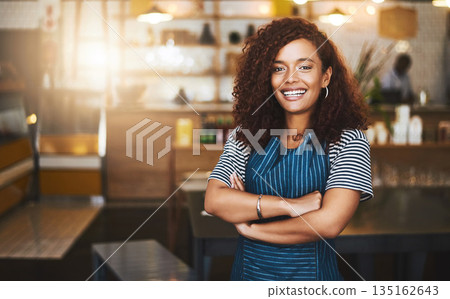 Coffee shop, crossed arms and portrait of woman in cafe for service, working and professional in bistro. Small business owner, restaurant startup and female waiter smile in cafeteria ready to serve 135162643