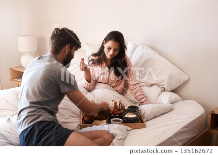Morning, couple and eating breakfast in bed, home food and bonding over Valentines day surprise meal. Scotland honeymoon vacation, love and romantic man, hungry woman or people relax in hotel bedroom Morning, couple and eating breakfast in bed, home food and bonding over Valentines day surprise meal. Scotland honeymoon vacation, love and romantic man, hungry woman or people relax in hotel bedroom 135162672
