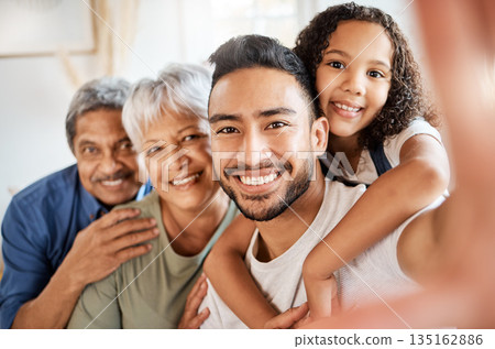 Happy family, portrait and smile of selfie in hug for social media, vlog or online post at home. Grandparents, father or face of child smiling for embrace of photo, memory or profile picture together Happy family, portrait and smile of selfie in hug for social media, vlog or online post at home. Grandparents, father or face of child smiling for embrace of photo, memory or profile picture together 135162886