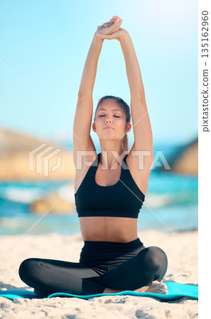 Woman, stretching and yoga with balance at the beach for zen, wellness and mental health in cape town. Meditation, stretch and exercise with yogi at the ocean with mat for fitness, self care, peace. 135162960