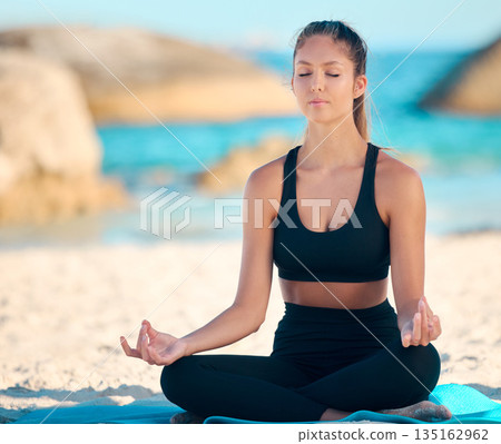 Yoga, calm and meditate on the beach with zen on a mat for wellness in cape town for workout. Ocean, balance and yogi with peace with lotus in summer for fitness with mental health and freedom. Yoga, calm and meditate on the beach with zen on a mat for wellness in cape town for workout. Ocean, balance and yogi with peace with lotus in summer for fitness with mental health and freedom. 135162962