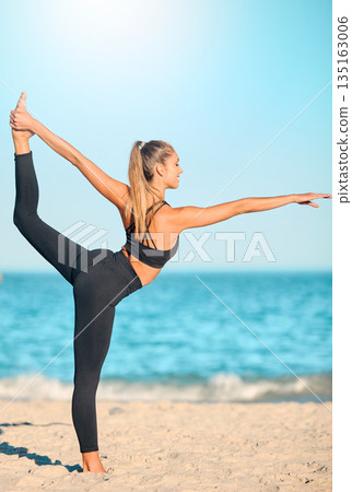 Yoga, woman and stretching body on the beach for exercise, training or wellness in summer nature. Female athlete, stretch and outdoor workout with ocean, sea or waves for calm, peace or balance Yoga, woman and stretching body on the beach for exercise, training or wellness in summer nature. Female athlete, stretch and outdoor workout with ocean, sea or waves for calm, peace or balance 135163006