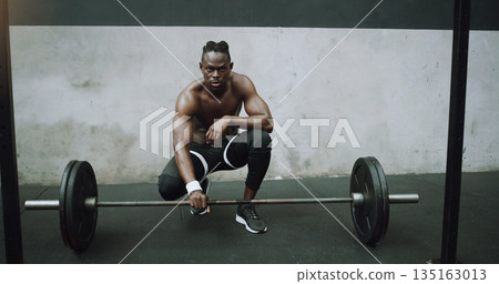 Weightlifting, fitness and portrait of black man with barbell in gym for training, exercise and workout. Strong body, muscle and male bodybuilder lift weights for challenge, wellness and strength Weightlifting, fitness and portrait of black man with barbell in gym for training, exercise and workout. Strong body, muscle and male bodybuilder lift weights for challenge, wellness and strength 135163013