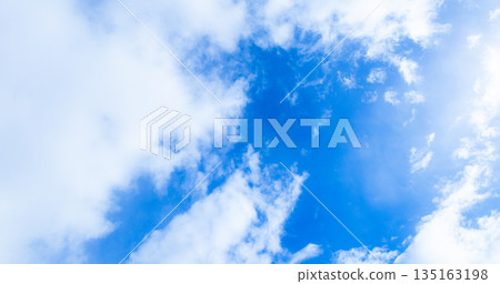 A simple landscape of blue sky and white clouds 135163198