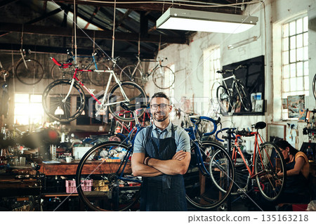 Happy, portrait and repair man in bicycle shop with arms crossed in small business workshop. Owner, bike mechanic and smile of confident person, professional or mature technician and glasses in store Happy, portrait and repair man in bicycle shop with arms crossed in small business workshop. Owner, bike mechanic and smile of confident person, professional or mature technician and glasses in store 135163218