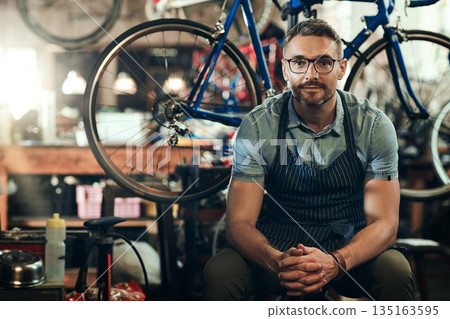Portrait, mechanic and man in bicycle shop, store and cycling workshop for repairs. Entrepreneur, bike technician and mature male person, small business owner and retail service expert from Canada 135163595
