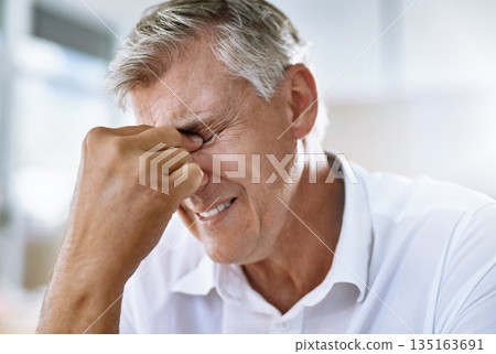 Pain, headache and senior businessman in the office with a corporate mistake or company crisis. Exhausted, burnout and sick professional mature male manager with a stress migraine in workplace. 135163691