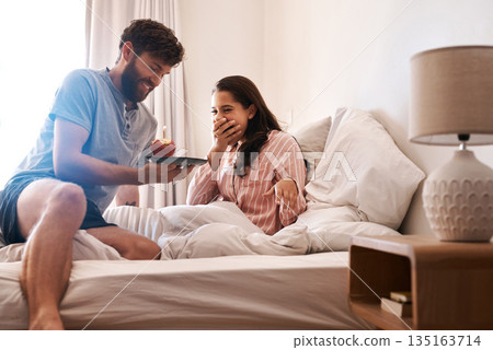 Couple, bedroom and surprise birthday candle, cupcake or celebration dessert for excited woman shocked over food gift. Muffin, wow and people smile, happiness and celebrate special day on home bed Couple, bedroom and surprise birthday candle, cupcake or celebration dessert for excited woman shocked over food gift. Muffin, wow and people smile, happiness and celebrate special day on home bed 135163714