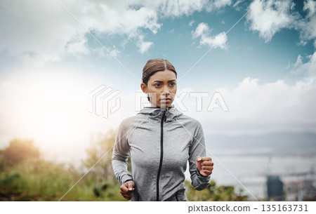 Training, sky and Indian woman with exercise, running and fitness with balance, workout goal and target. Female person, runner or athlete practice, run or energy with focus, concentration or wellness 135163731