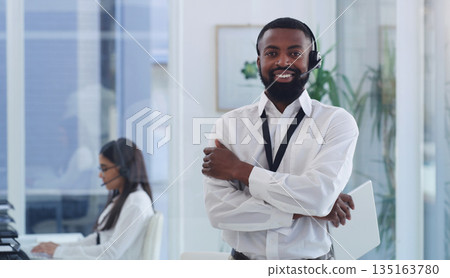 Call center, portrait or black man with arms crossed in customer service, support or telemarketing office. Employee, businessman or crm consultant with tablet, technology or contact us for advice Call center, portrait or black man with arms crossed in customer service, support or telemarketing office. Employee, businessman or crm consultant with tablet, technology or contact us for advice 135163780