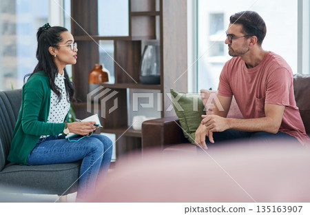 Mental health, psychology or counseling with a woman therapist and male patient talking in her office. Psychologist, therapy and trust with a female doctor or shrink consulting a man for healing Mental health, psychology or counseling with a woman therapist and male patient talking in her office. Psychologist, therapy and trust with a female doctor or shrink consulting a man for healing 135163907