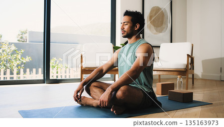Meditation, calm man or yoga mat in home for morning routine, relaxation or body awareness practice. Mindfulness, inner peace or person in lounge with mental health zen, wellness or holistic healing Meditation, calm man or yoga mat in home for morning routine, relaxation or body awareness practice. Mindfulness, inner peace or person in lounge with mental health zen, wellness or holistic healing 135163973