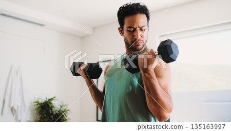 Fitness, man and weightlifting in home with dumbbells for strength training, workout or bodybuilding. Active, person or bodybuilder in apartment with exercise, lifting weights and muscle development. Fitness, man and weightlifting in home with dumbbells for strength training, workout or bodybuilding. Active, person or bodybuilder in apartment with exercise, lifting weights and muscle development. 135163997