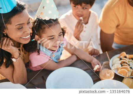 Birthday, mother and children with food in park for event, celebration and party outdoors together. Family, fun social gathering and happy mother with kids at picnic with cake, presents and snacks 135164076